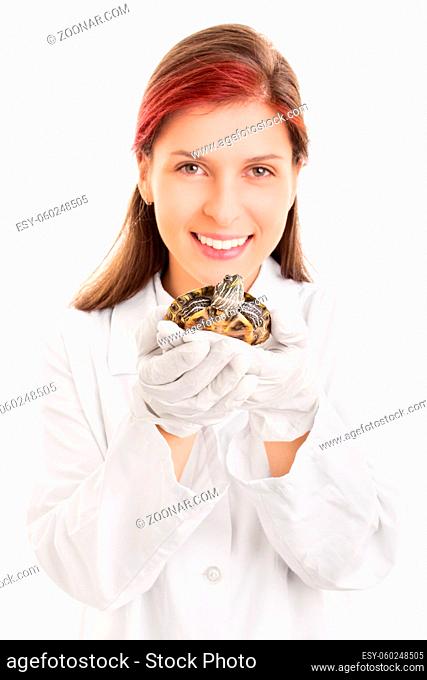 I love animals. Close up shot of a beautiful smiling young veterinarian holding a pet turtle, isolated on white background