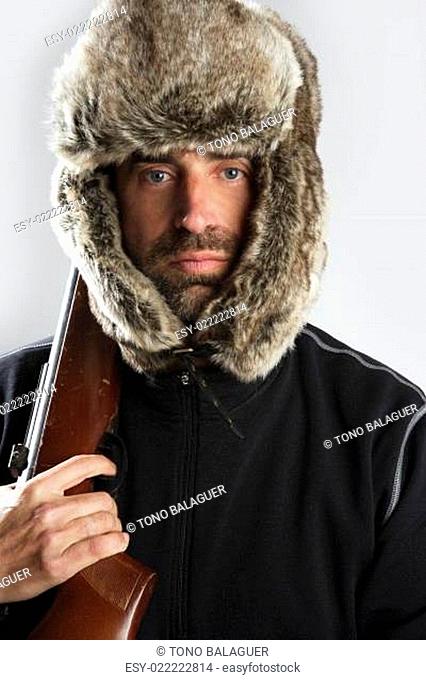 hunter winter fur hat man portrait holding gun