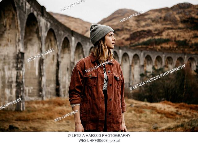 UK, Scotland, Highland, portrait of young woman at Glenfinnan Viaduct