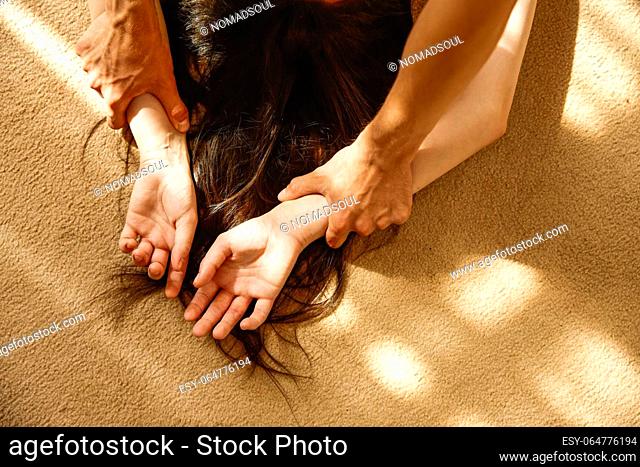 Passionate heterosexual lovers on floor. Romantic date and sensuality in people relationships concept. Closeup view