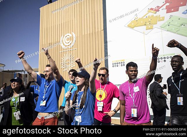 11 November 2022, Egypt, Sharm El-Sheikh: Activists shout slogans at a Nuclear for Climate protest during the 2022 United Nations Climate Change Conference...