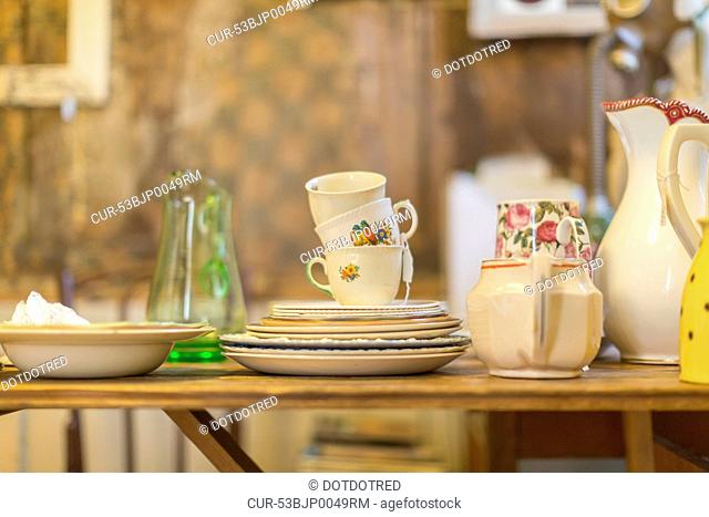 Decorative dishes piled on table