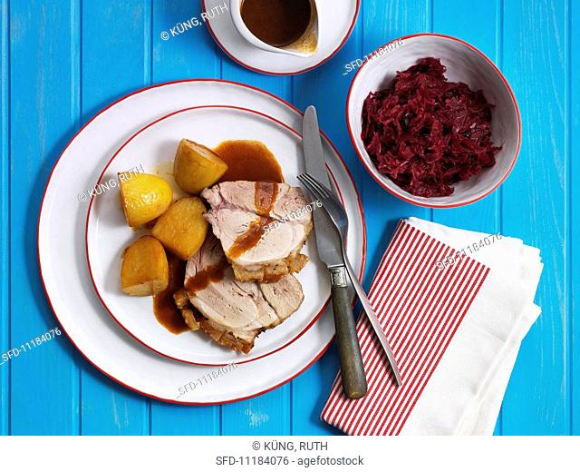 Roast pork with crackling, served with potatoes and red cabbage (Denmark)
