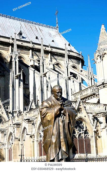 Statue of John Paul II with Notre Dame in Background