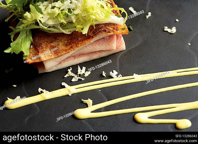 Eel with frisee lettuce and a mustard emulsion