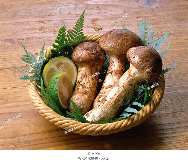 Matsutake mushrooms with Citrus fruit in Basket
