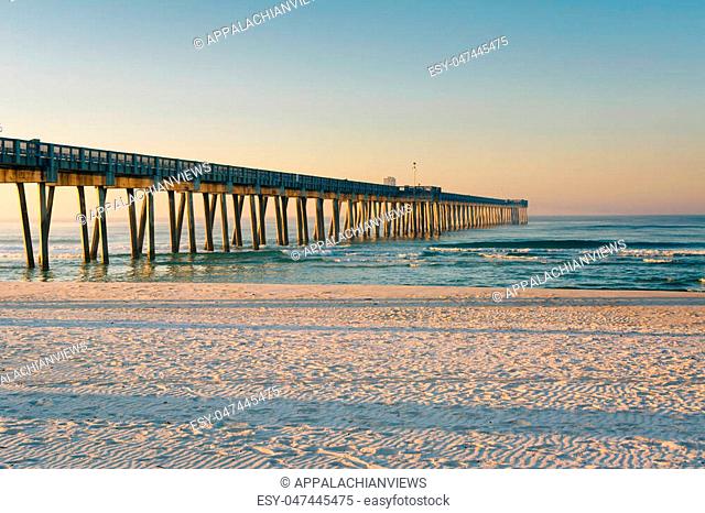 Morning light on the M.B. Miller County Pier and sandy beach along the Gulf of Mexico, in Panama City Beach, Florida