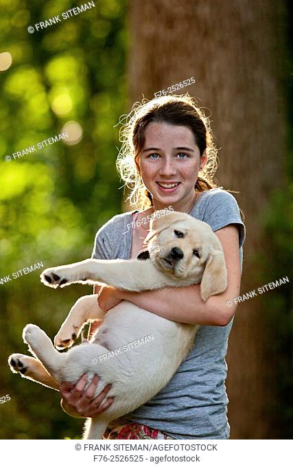 14 year old girl holding 10 week old yellow labrador retriever puppy, MR # 4862