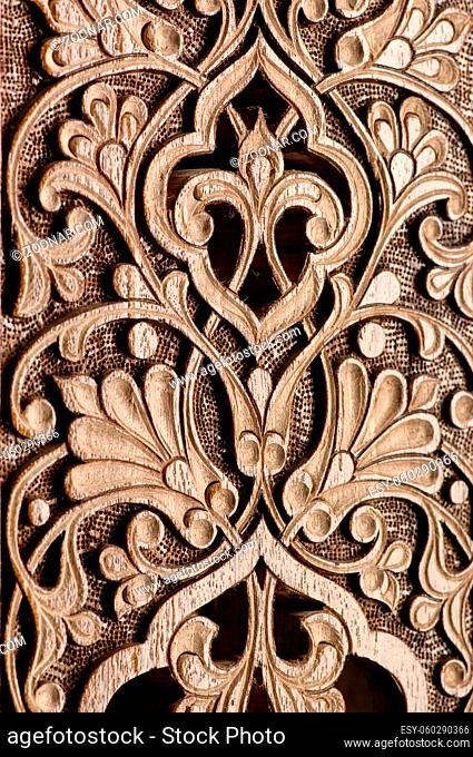 Oriental and Asian traditional element of decorative woodcarving closeup