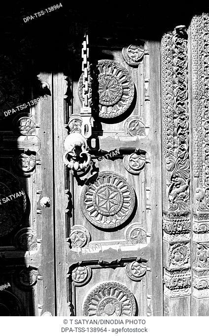 Carved door of building in heritage village at Manipal in District of Karnataka ; India