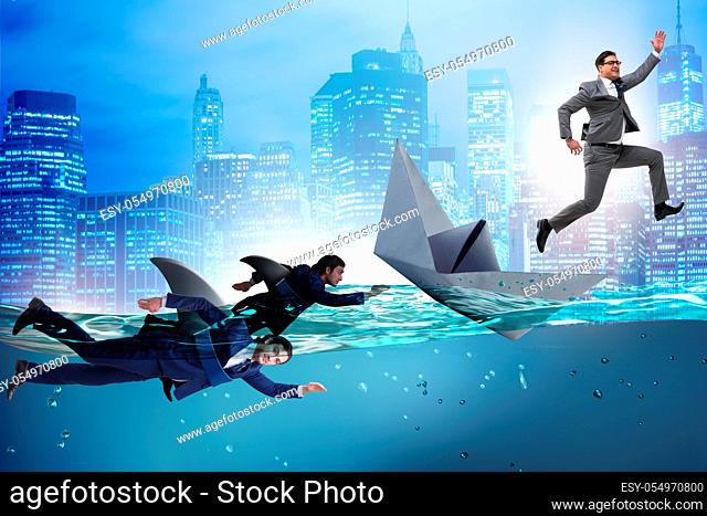 Businessmen in competition concept with shark