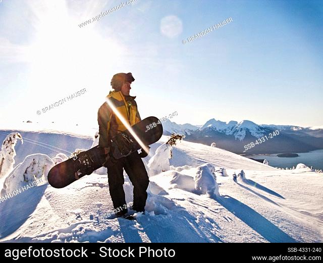 A snowboarder stands on the west ridge of Juneau's Eaglecrest Ski Area