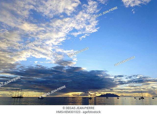 Seychelles, Mahe Island, Beau Vallon Bay, Beau Vallon Beach with Silhouette Island far away at sunset