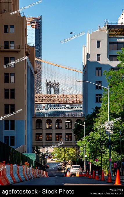 New York, City / USA - JUL 10 2018: Manhattan Bridge with helicopter on top view from Brooklyn Heights New York City