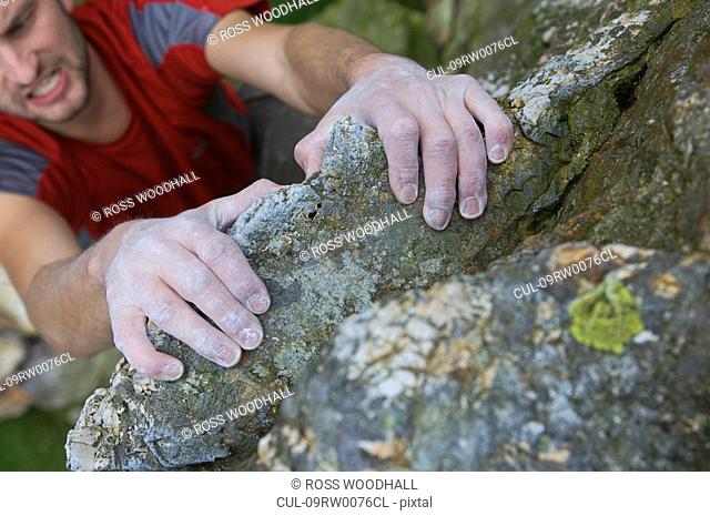 Climbers hands on a rock face