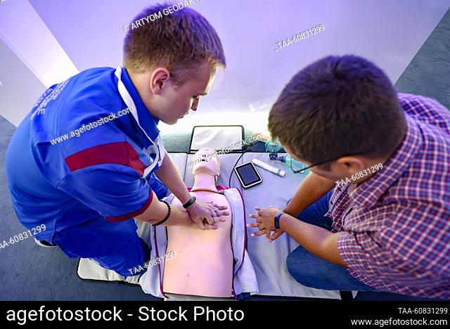 RUSSIA, MOSCOW - AUGUST 2, 2023: A man shows resuscitation skills on a dummy at an exhibition during the 3rd Urban Health International Congress in Gostiny Dvor...
