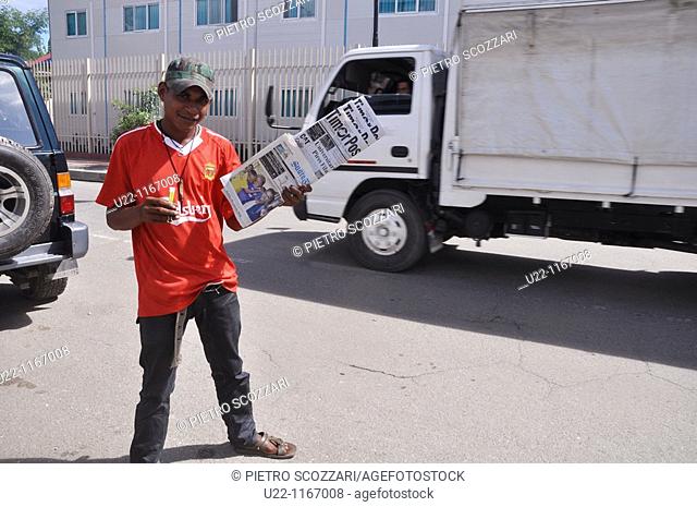 Dili (East Timor): a newspapers seller in a street of the city's center