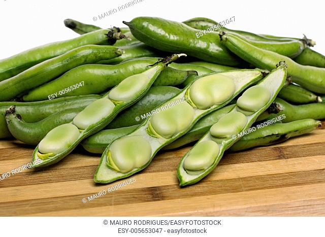 Close up view of some broad beans isolated on a white background