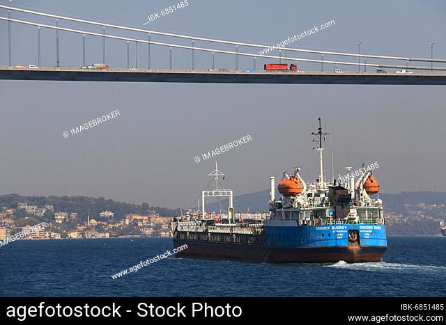 A freighter at the second Bosphorus bridge, the Fatih Sultan Mehmet Bridge, Istanbul Turkey