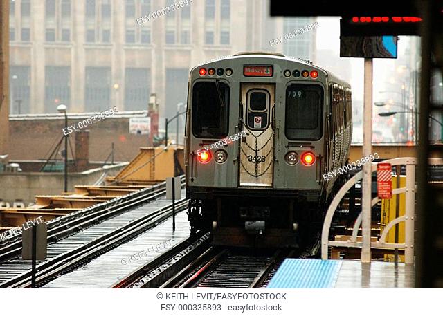 Chicago, Illinois, Train moving on the tracks at CTA Station in Chicago