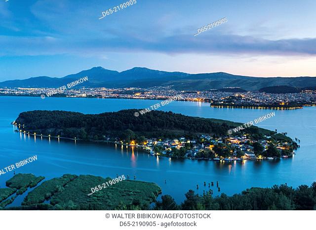 Greece, Epirus Region, Ioannina, elevated city view, Lake Pamvotis and Nisi Island, dusk