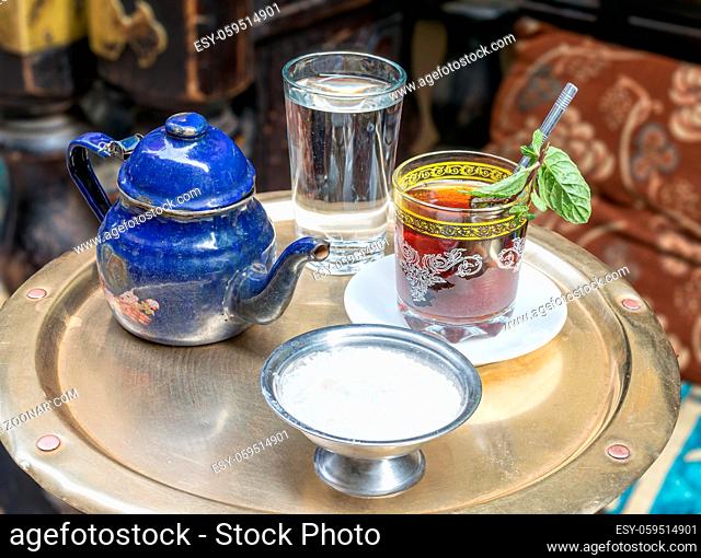 Traditional mint tea set on copper table in an oriental cafe at Khan El Kalili Bazar, Cairo, Egypt