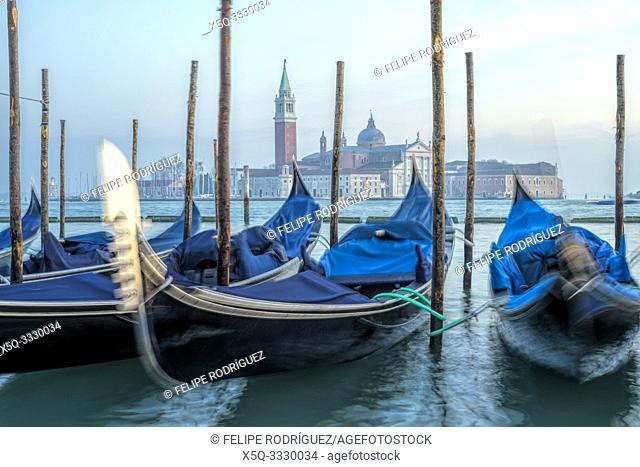 Moored gondolas with San Giorgio Maggiore on the background, Riva degli Schiavoni, Venice, Italy