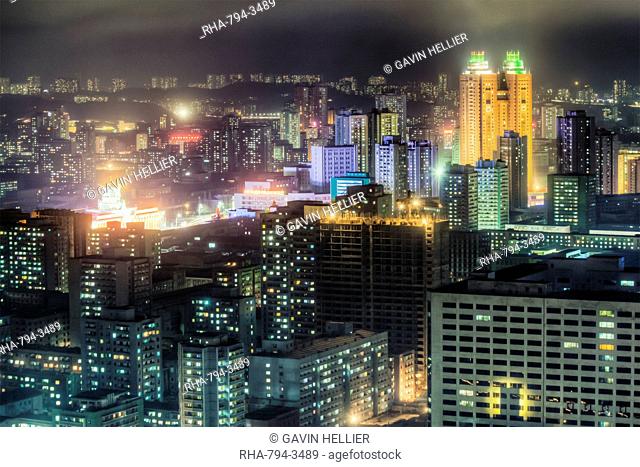 New modern buildings in the centre of Pyongyang colourfully illuminated at night, Pyongyang, Democratic People's Republic of Korea DPRK, North Korea, Asia