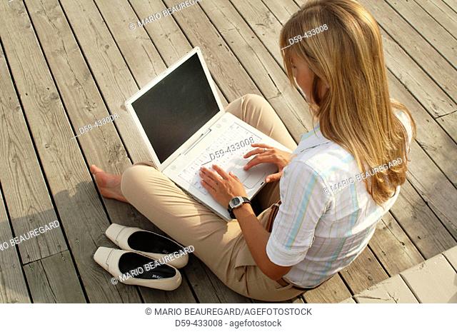 Young career woman, working on laptop computer