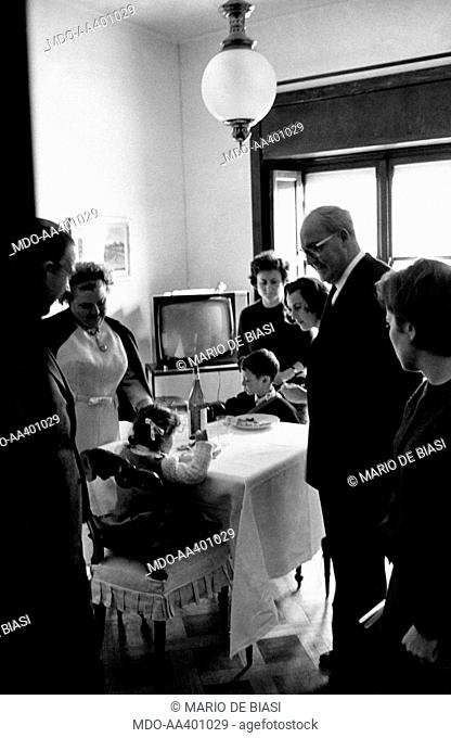 The President of the Italian Republic Giuseppe Saragat watching his Italian grandchildren Giuseppina Santacatterina and Augusto Santacatterina having their meal