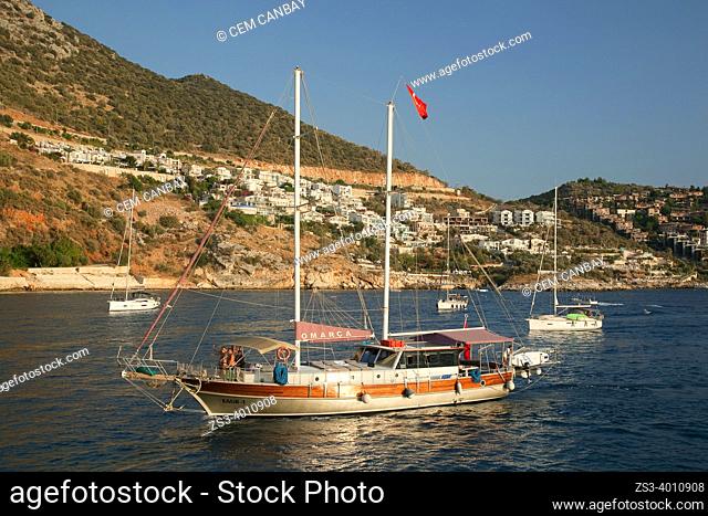 Daily excursion boat turning back from the trip to the port of Kalkan at the afternoon light, Antalya Province, Mediterranean Coast, Ancient Lycia Region