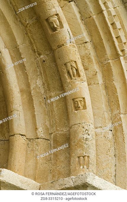 Detail of an archivolt showing unusual decoration wich may represent figures buried in stone, San Pantaleon de Losa Hermitage