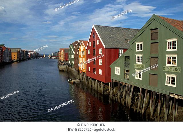 old storehouses flanking both sides of river Nidelva, Norway, Trondheim