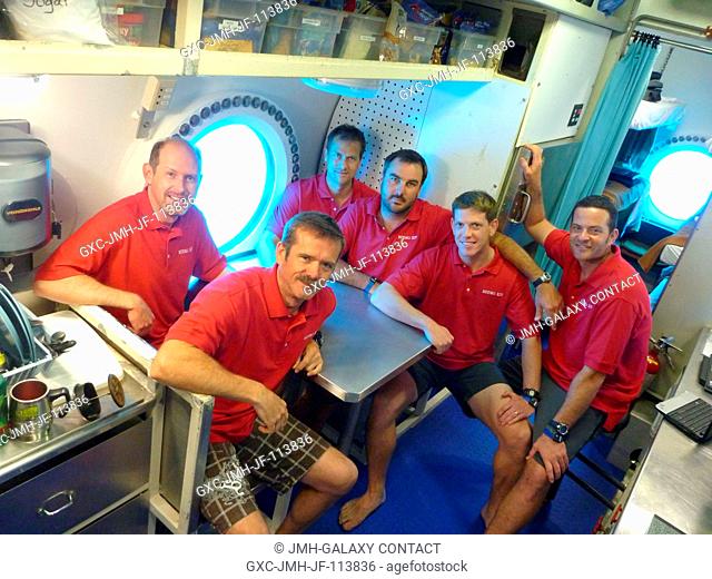 NEEMO 14 crew members and habitat technicians pose for a group photo inside their undersea habitat for the 14th NASA Extreme Environment Mission Operations...