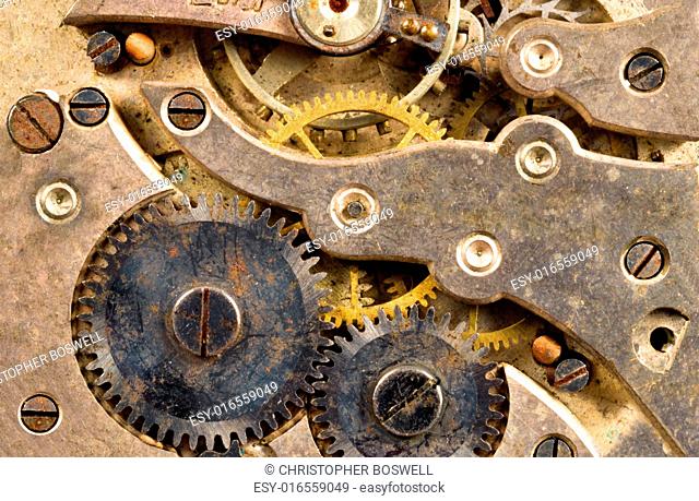 Extreme close up of the inside workings of a jeweled pocket watch time piece