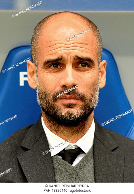 Munich's head coach Pep Guardiola (R) on the sidelines during the Bundesliga soccer match between Hamburger SV and FC Bayern Munich at Imtech Arena in Hamburg