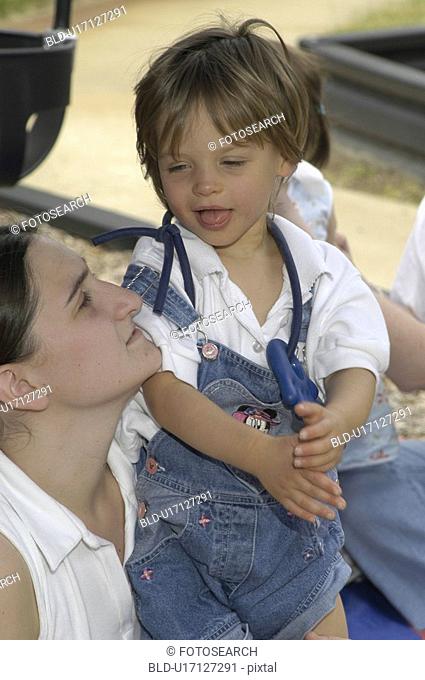Loving look shared between a mother and her child with disabilities