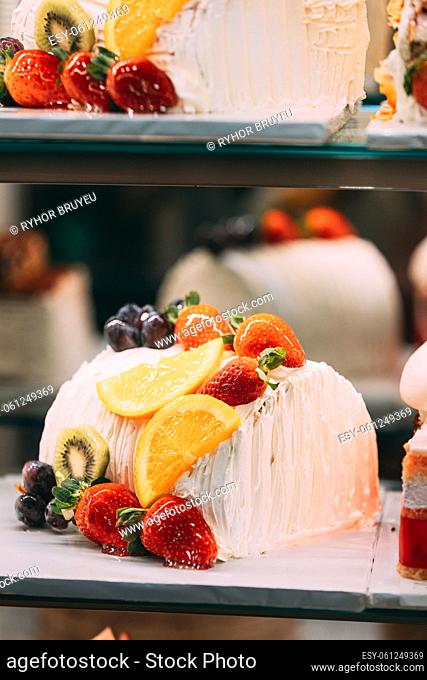 yummy assortment baked pastry in bakery. Various Different Types Of Sweet Cakes In Pastry Shop Glass Display. Good Assortment Of Confectionery