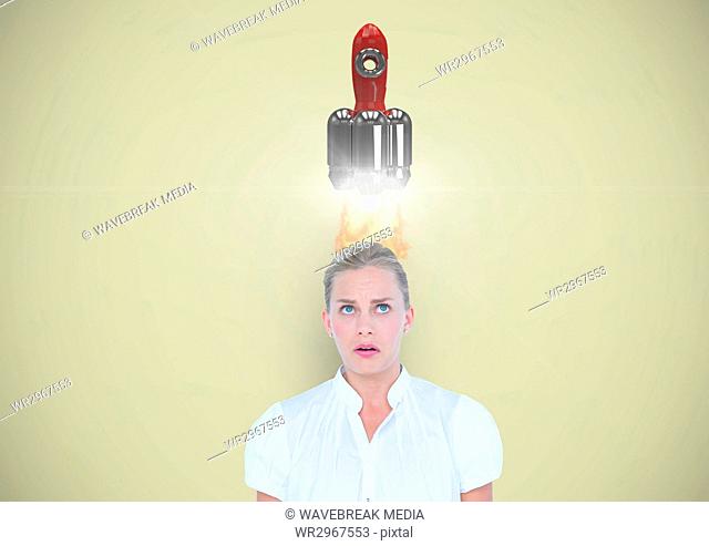 Digital composite image of rocket launch on overhead of businesswoman