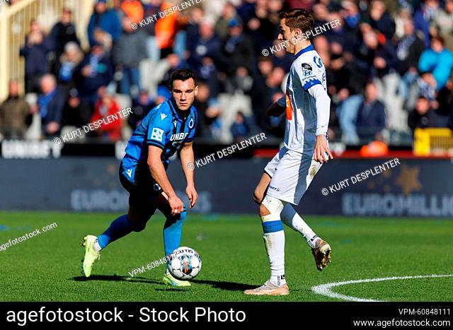 Club's Ferran Jutgla and Gent's Julien De Sart fight for the ball during a soccer match between Club Brugge KV and KAA Gent, Sunday 26 February 2023 in Brugge