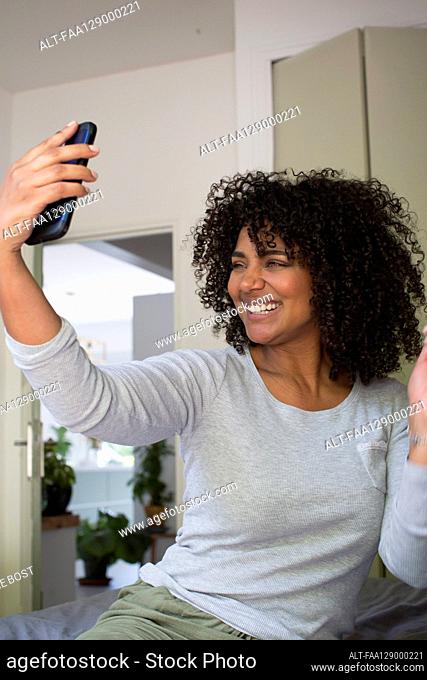 Smiling woman taking a selfie