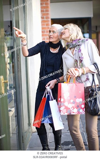 Older women window shopping together