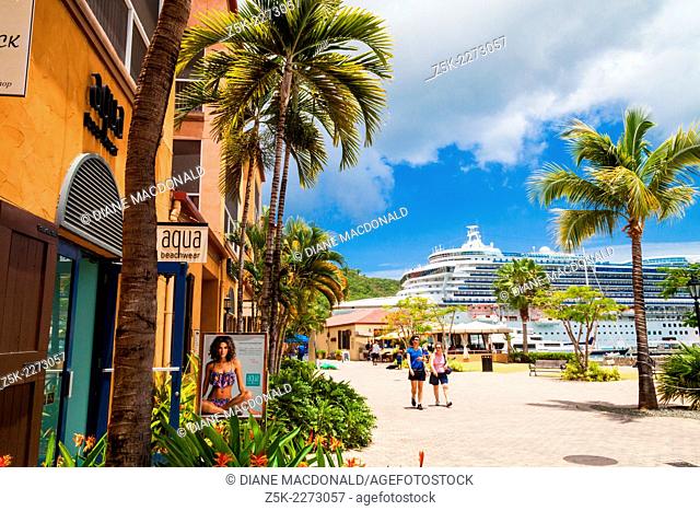 A cruise ship in port at Charlotte Amalie, St. Thomas, US Virgin Islands seen from the dockside shopping center