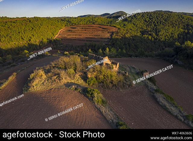 Remains of the ancient house of Solivella, surrounded by fields at sunset (NavÃ s, Barcelona, Catalonia, Spain)