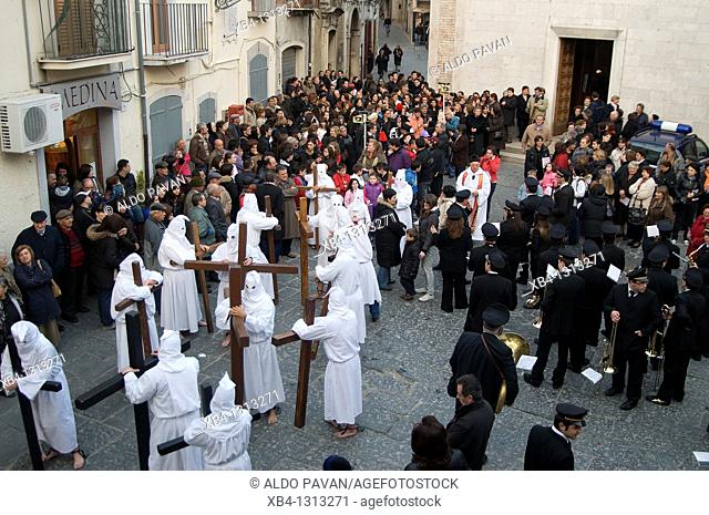 Italy, Apulia, Orsara, Good Friday procession with hooded people