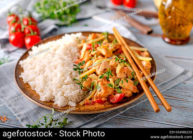 Spicy and hot red curry with vegetable, meat and rice