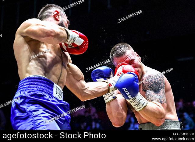 RUSSIA, MOSCOW - DECEMBER 16, 2023: Boxers Maxim Smirnov (R) of Russia and Leon Antonyan of Russia fight in a boxing bout as part of the IBA Champions' Night at...