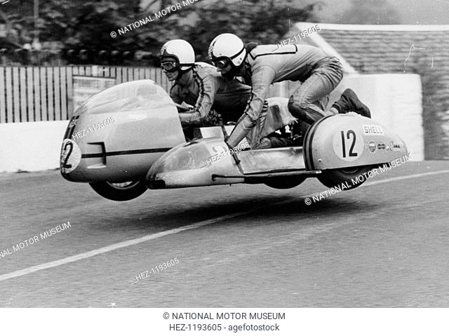 Sidecar TT race, Isle of Man, 1970. This motorcycle and sidecar combination are airborne as they cross Ballaugh Bridge on the TT circuit
