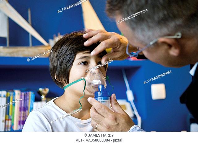 Boy receiving oxygen treatment