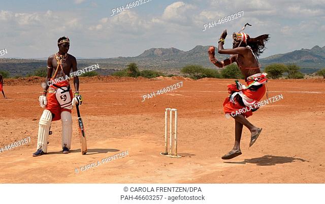 Players with the Maassai Cricket Warriors play a game in Il-Polei, Laikipia, Kenya, 10 July 2013. Photo: Carola Frentzen | usage worldwide